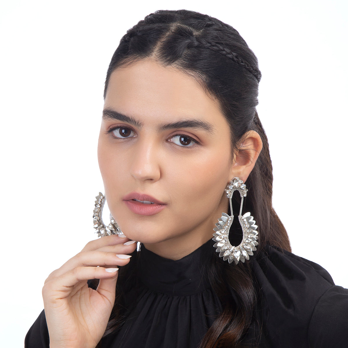 Model wearing handmade silver metallic earrings