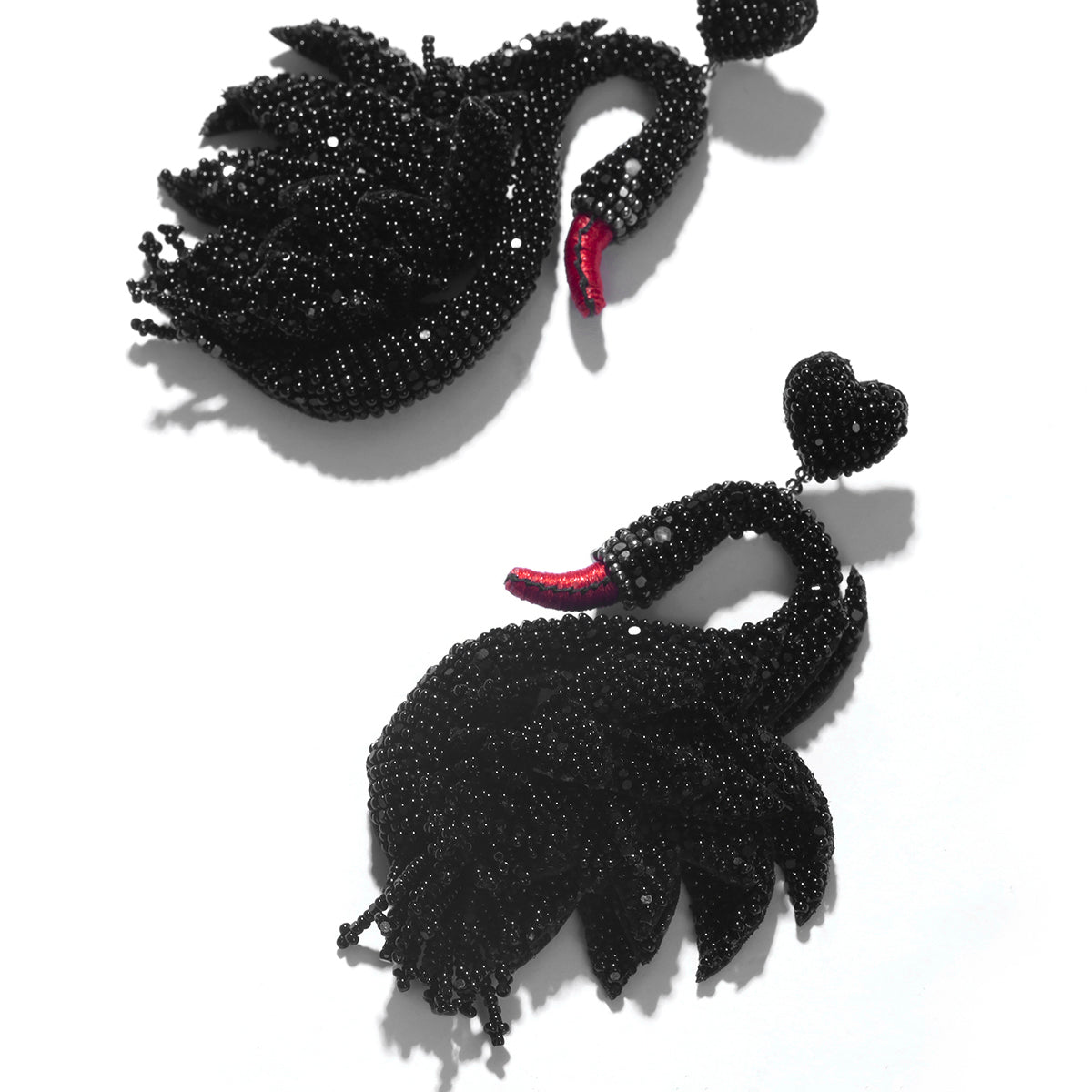 Detail In handmade embroidered swan earrings