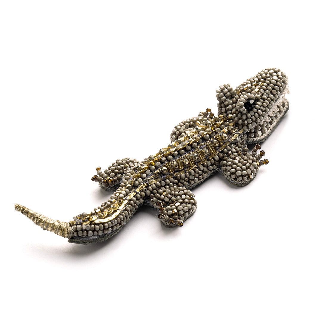 Detail of Deepa Gurnani handmade Aligator brooch in olive color