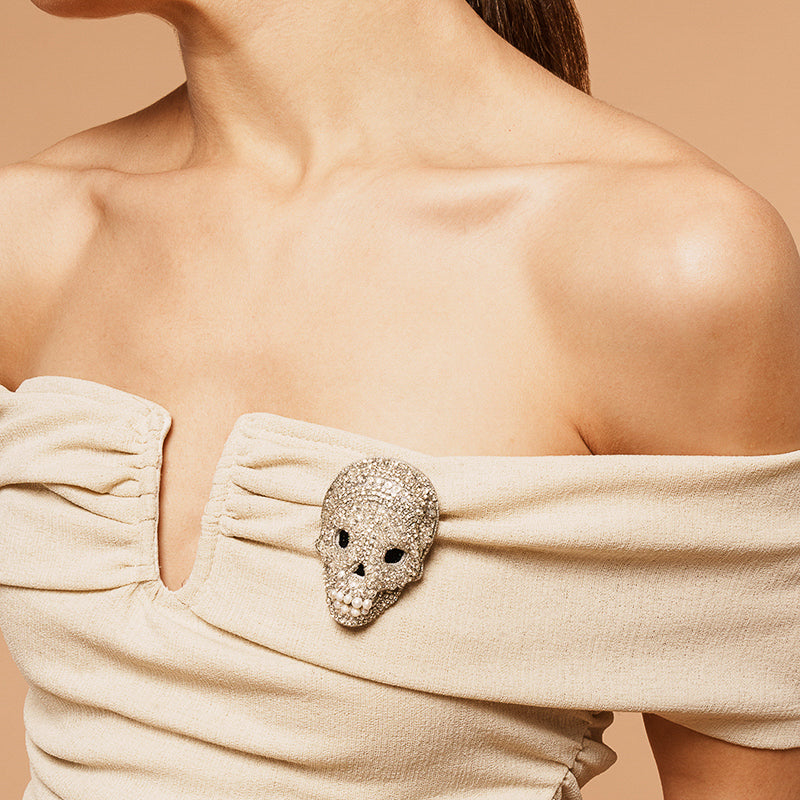 Model Wearing Deepa Gurnani handmade Skull On Ice Brooch in Silver color