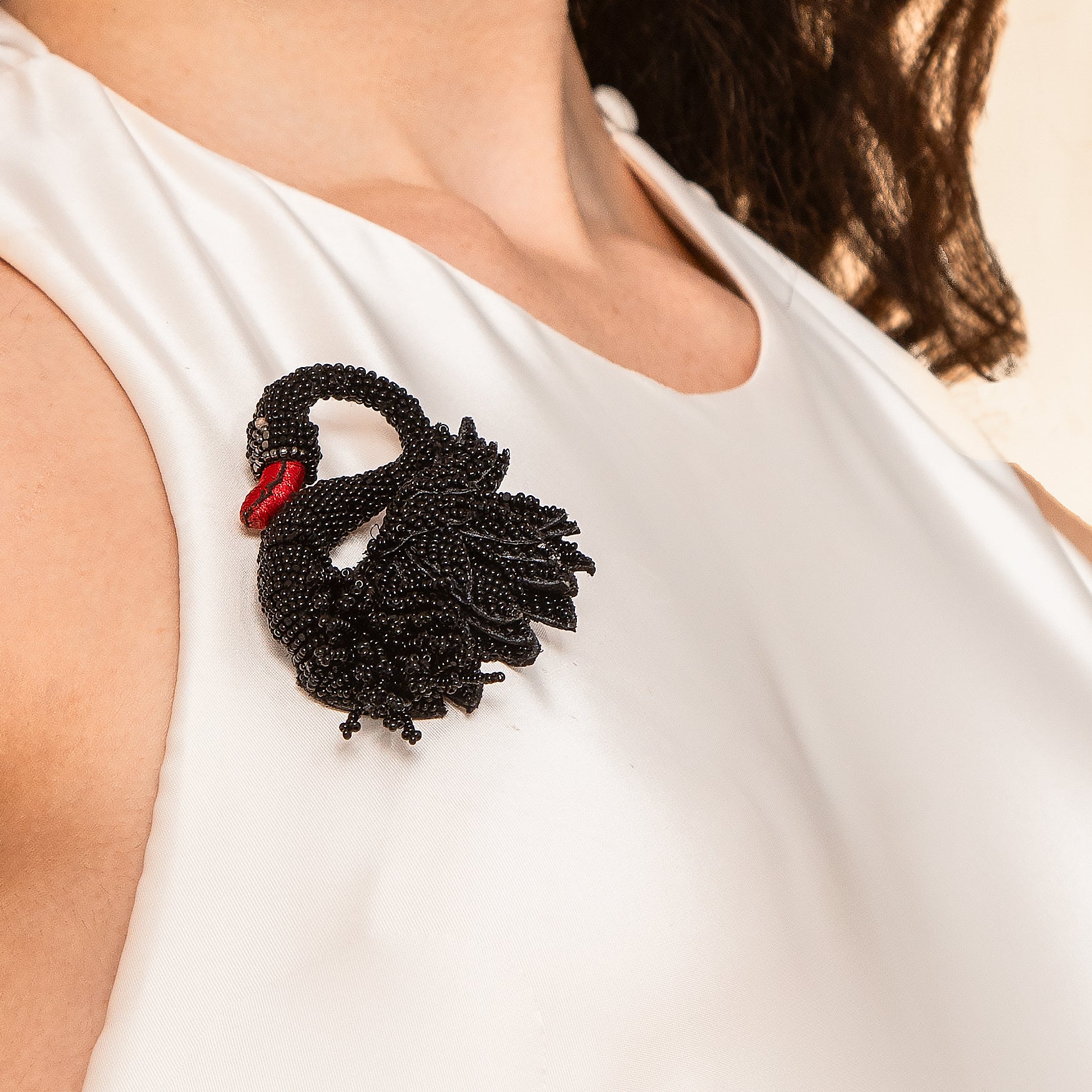 Model Wearing Deepa Gurnani handmade swan brooch in black color