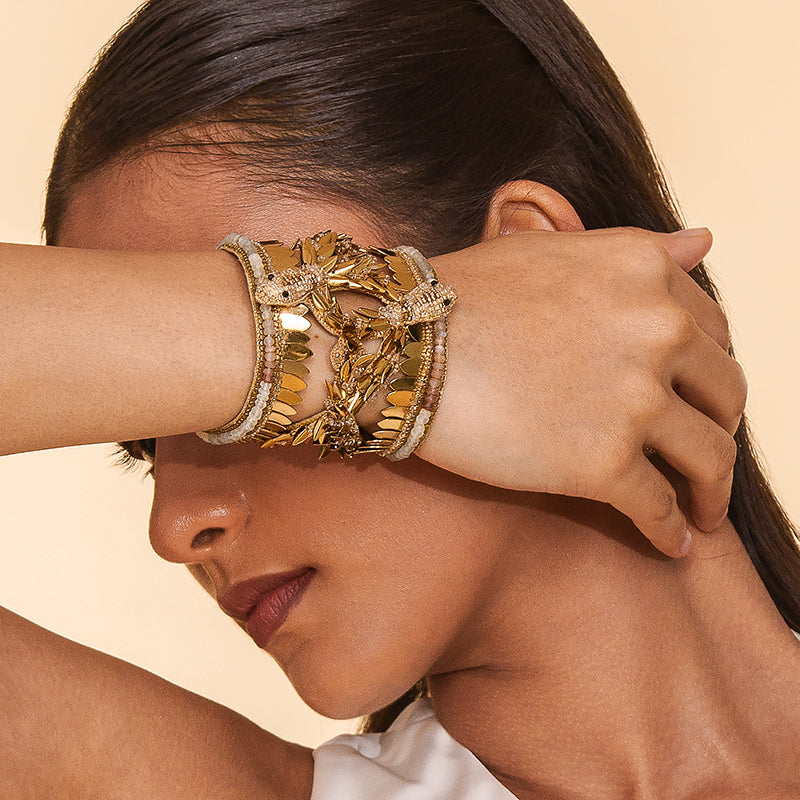 Model wearing Deepa Gurnani Handmade Serpent Cuff in gold color