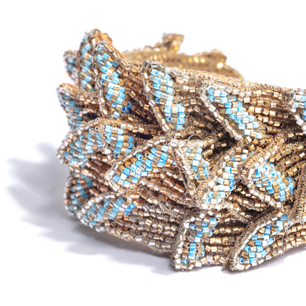 Detail of Deepa Gurnani Ines Cuff in auqa color