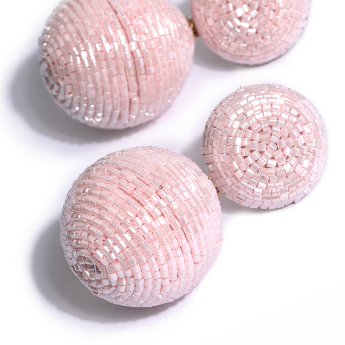 Detail of Deepa Gurnani handmade the Nica earrings in baby pink color