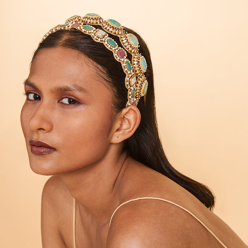 Model wearing Deepa Gurnani handmade the Charlene headband in Turquoise color