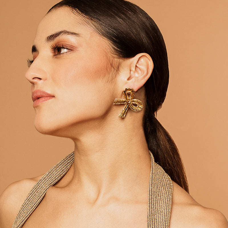 Model wearing our Deepa by Deepa Gurnani Handmade Luz Earrings in Gold color