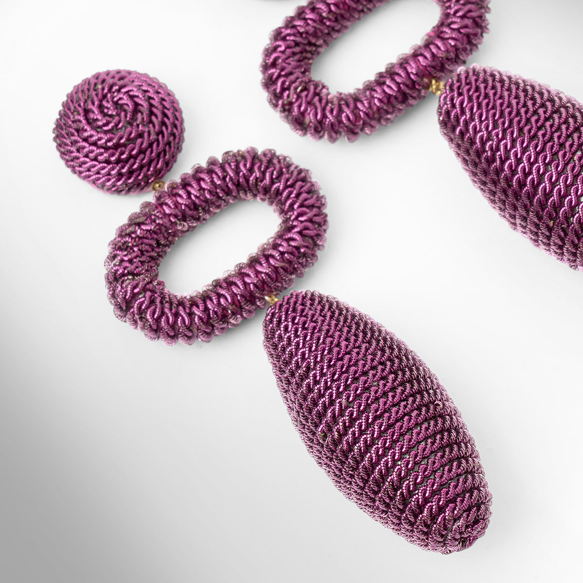 Close up of Deepa Gurnani Pret Fontana Earrings in purple color