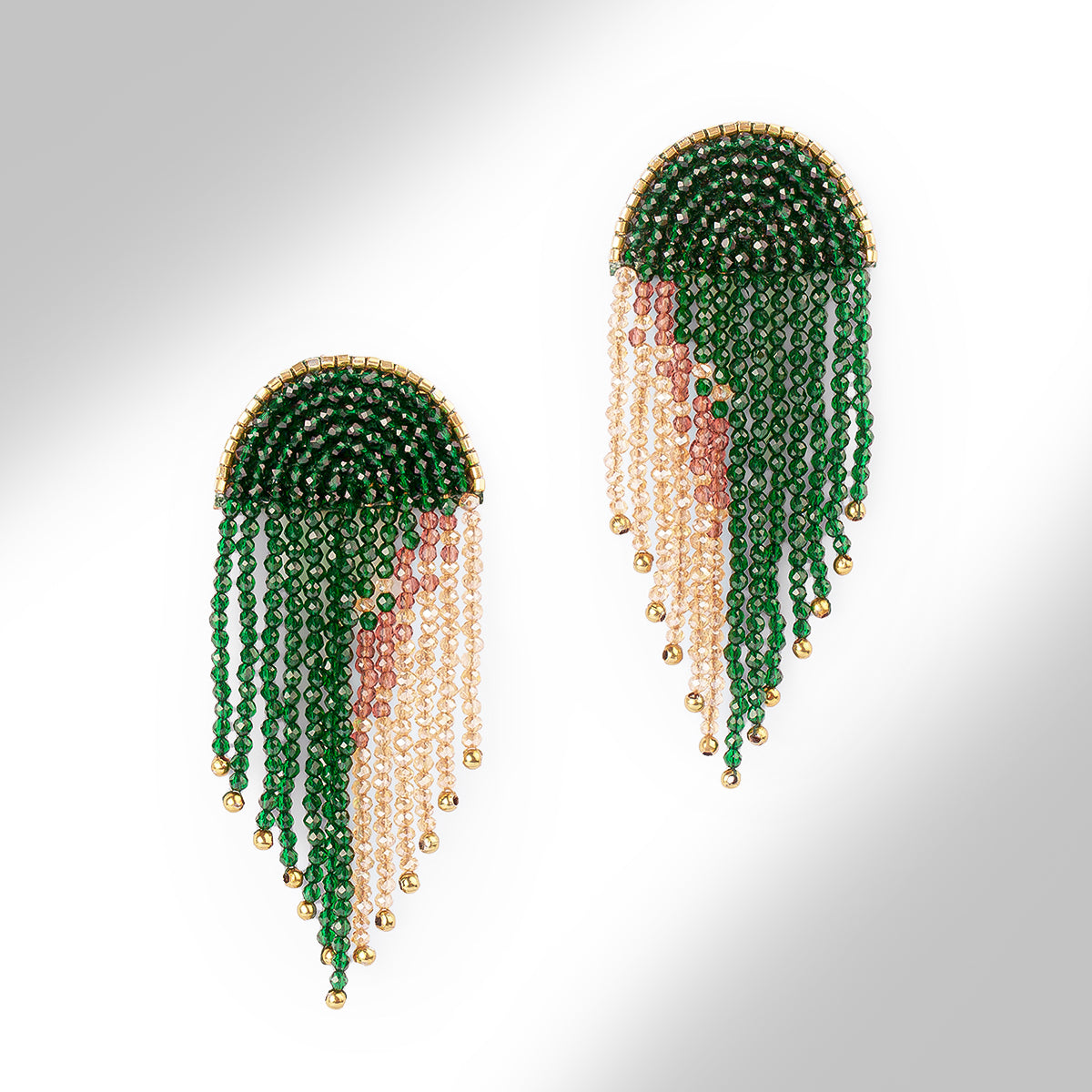 Beaded fringe earrings on a white background, featuring multiple strands of beads in dark green and champagne, accented with small gold beads.