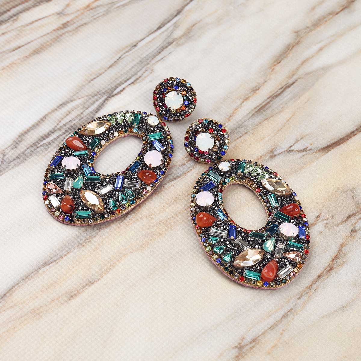 Detail Of Deepa Gurnani Handmade Multicolor Lainey Earrings on Marble Background