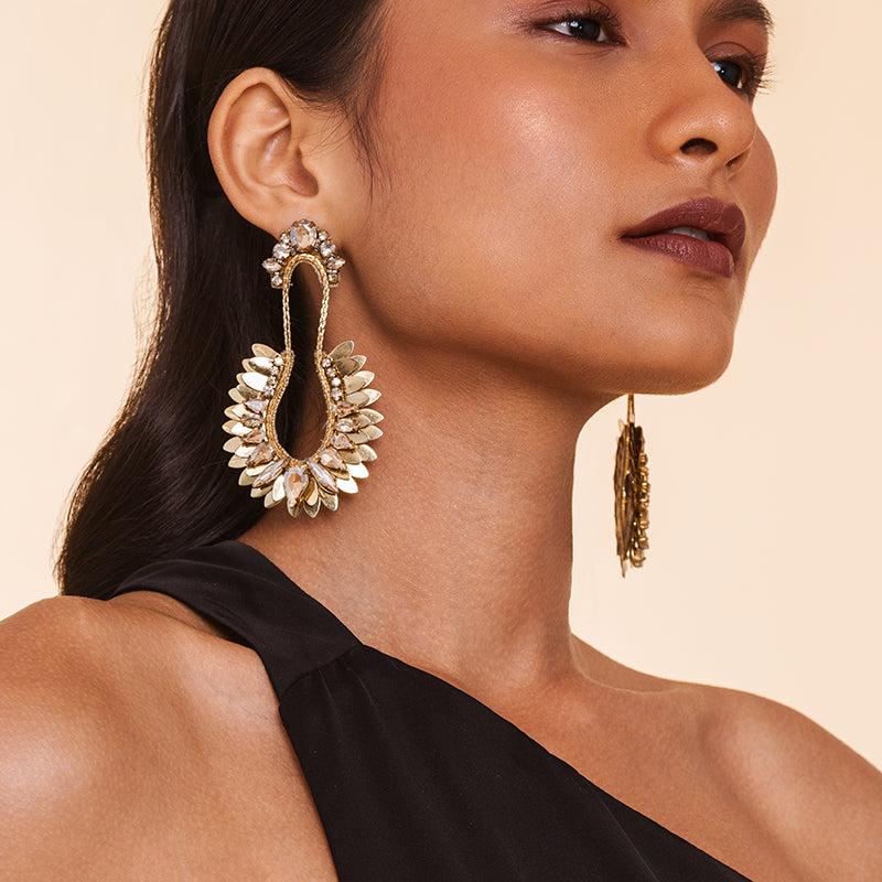 Detail of Model wearing Deepa Gurnani Handmade Nior Earrings Gold