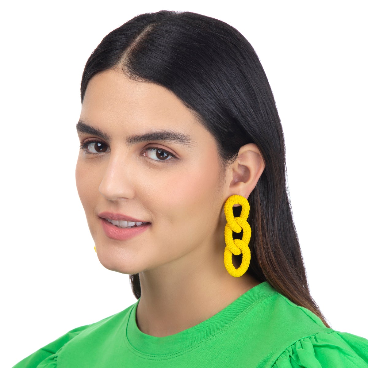 Model wearing beaded three link Linka Earrings