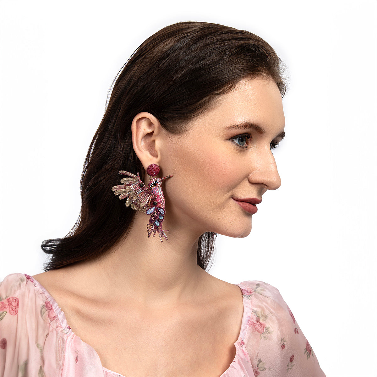 Model wearing Deepa Gurnani handmade the Hummingbird earrings in fuchsia color