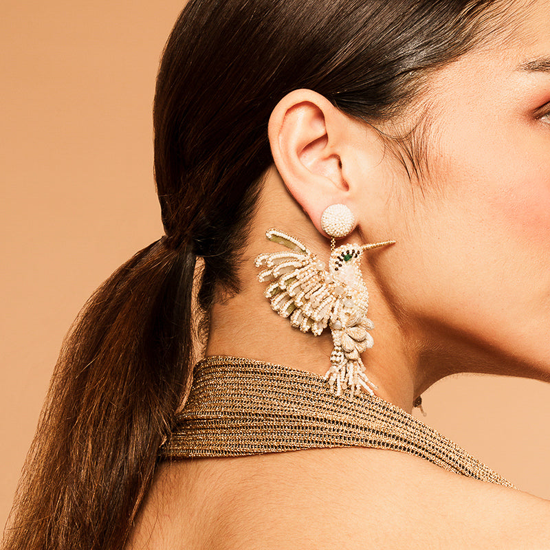 Model Wearing Deepa Gurnani handmade Hummingbird Earrings in Ivory color