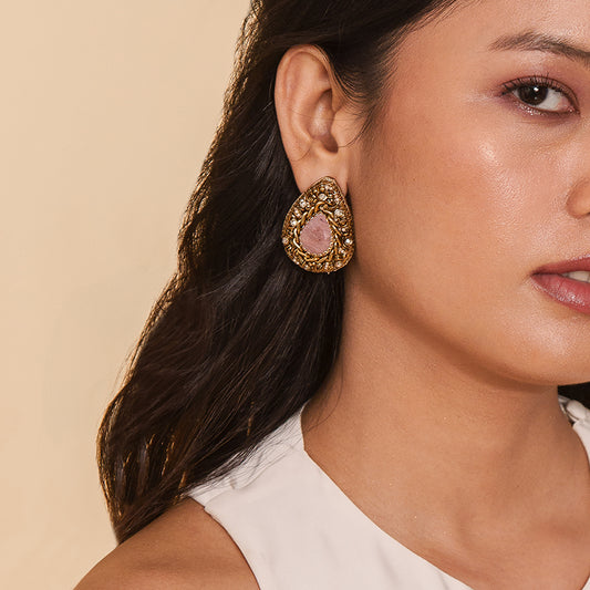 Model wearing Deepa Gurnani handmade the Oriana earrings in Dusty Pink color