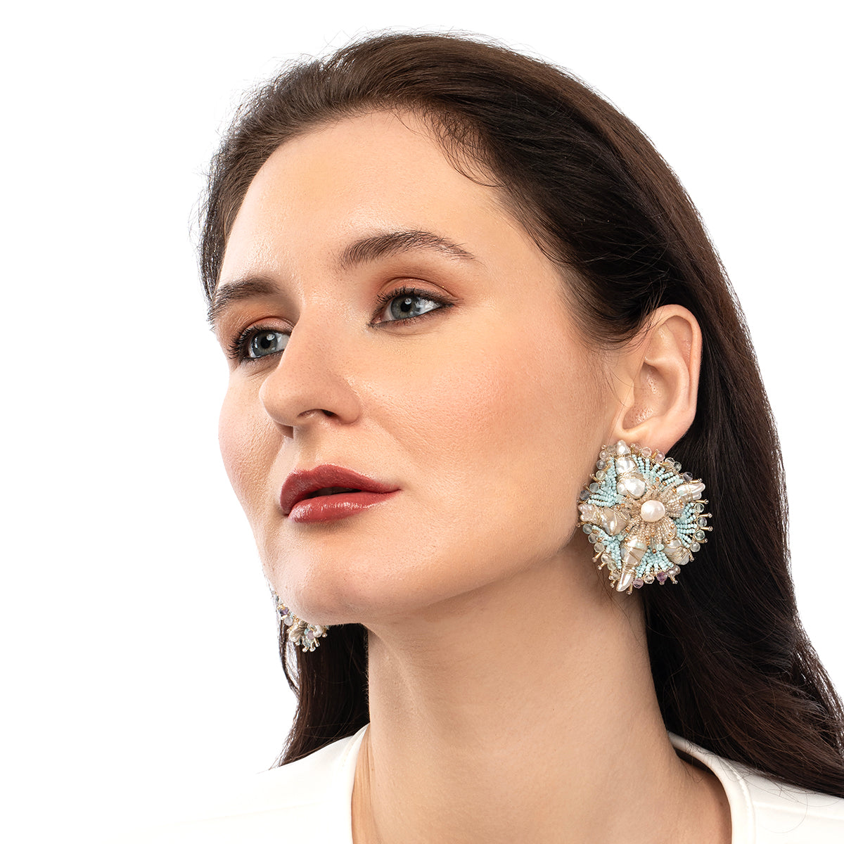 Model wearing Deepa Gurnani handmade the Andrena earring in baby blue color