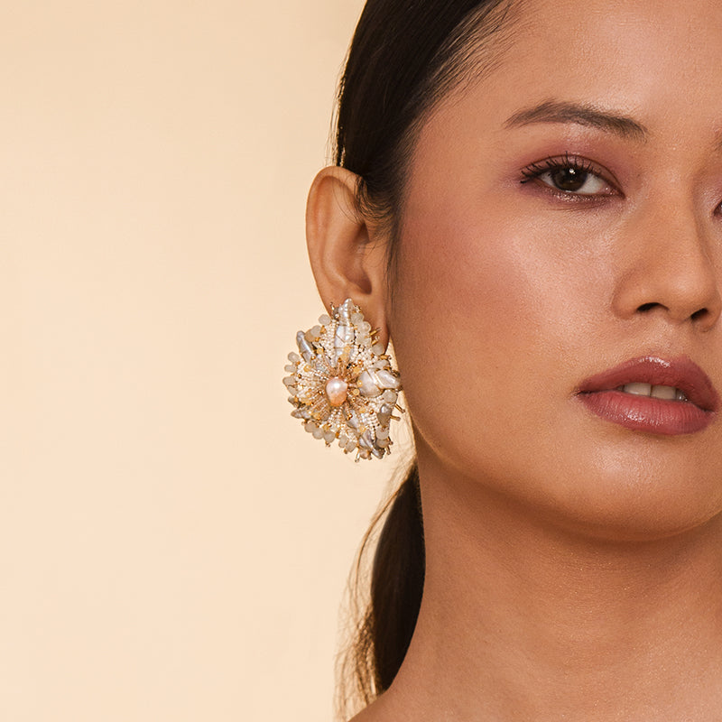 Detail Model wearing Deepa Gurnani handmade the Andrena earring in ivory color