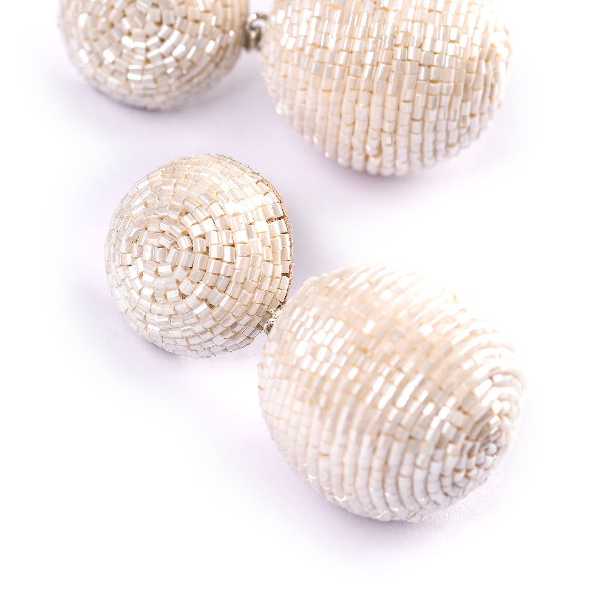 Detail of Deepa Gurnani handmade the Nica earrings in ivory color