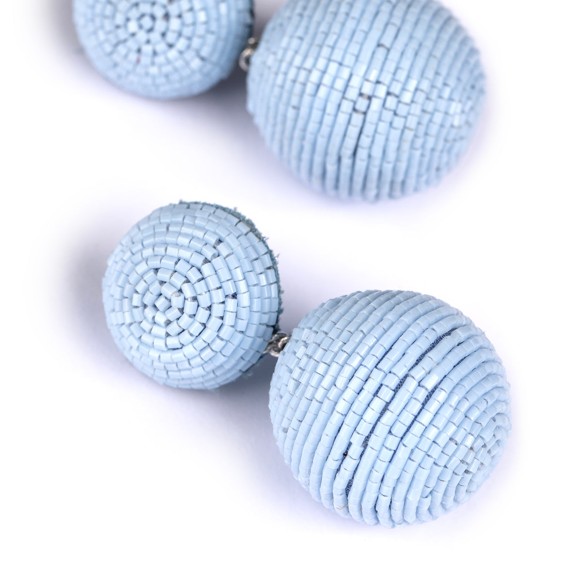 Detail of Deepa Gurnani handmade the Nica earrings in powder blue color