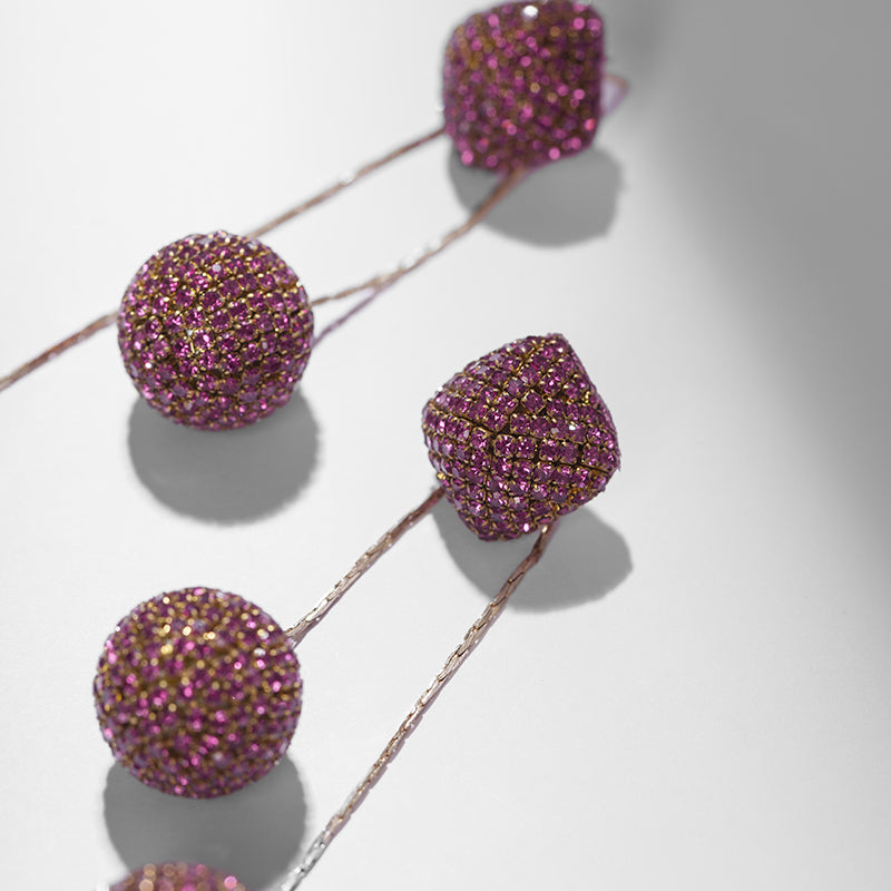 Detail of Deepa Gurnani handmade the Taryn earring in Fuchsia color