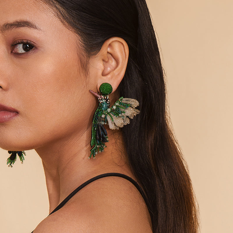 Model wearing Deepa Gurnani Handmade Green Hummingbird Earrings