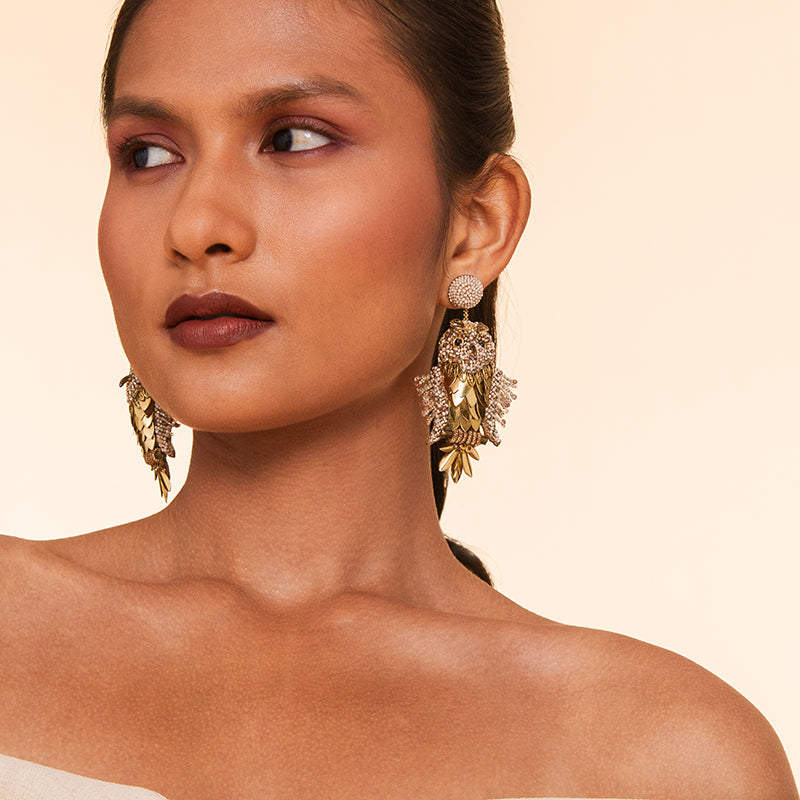 Model Wearing Deepa Gurnani handmade the Tawny earrings in Gold color.