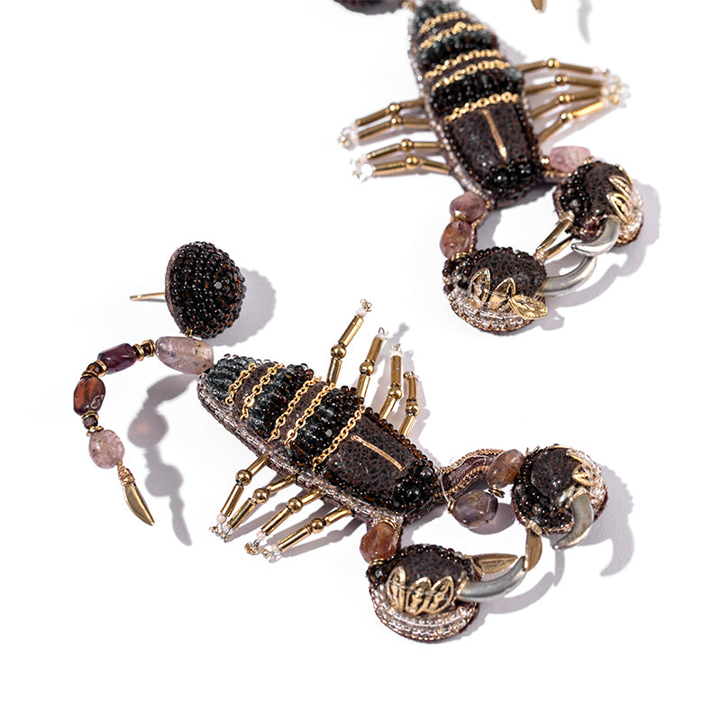 Detail of Deepa Gurnani handmade the Scorpion earrings in Brown color.