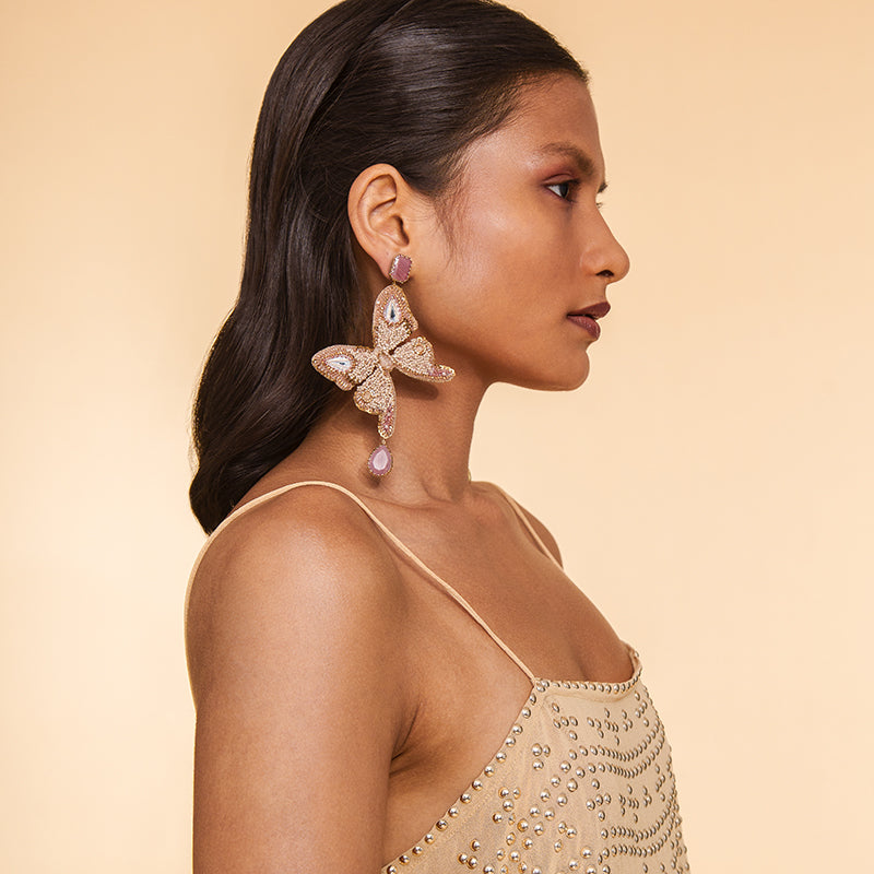 Model wearing Deepa Gurnani Handmade Ilona Earrings in Beige color