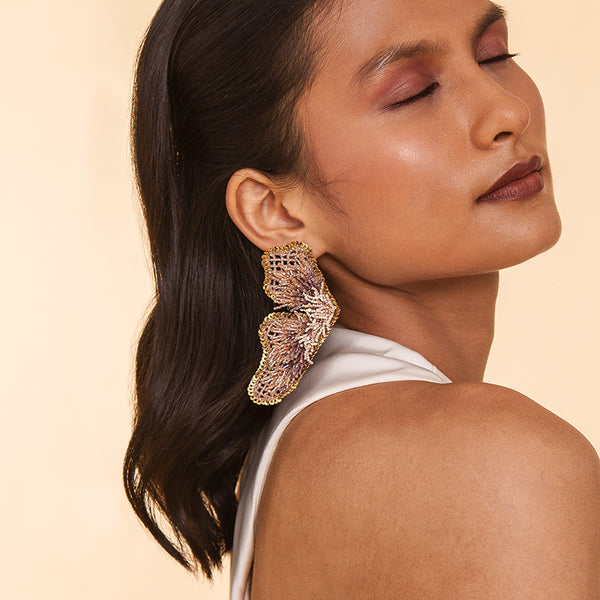 Detail of Model wearing Deepa Gurnani Handmade Lanelle Earrings in Black color