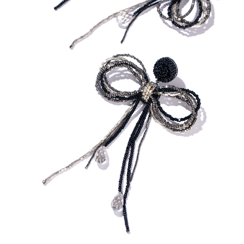 Detail of Deepa Gurnani Handmade Coquette Earrings in Black