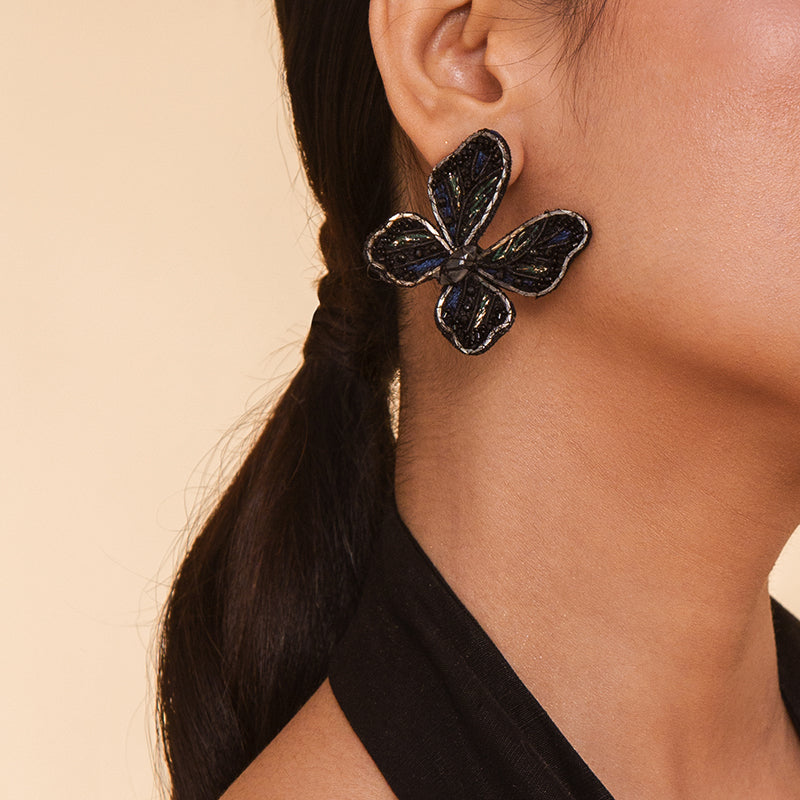 Detail of Model wearing Deepa Gurnani Handmade Abel Earrings in Black color