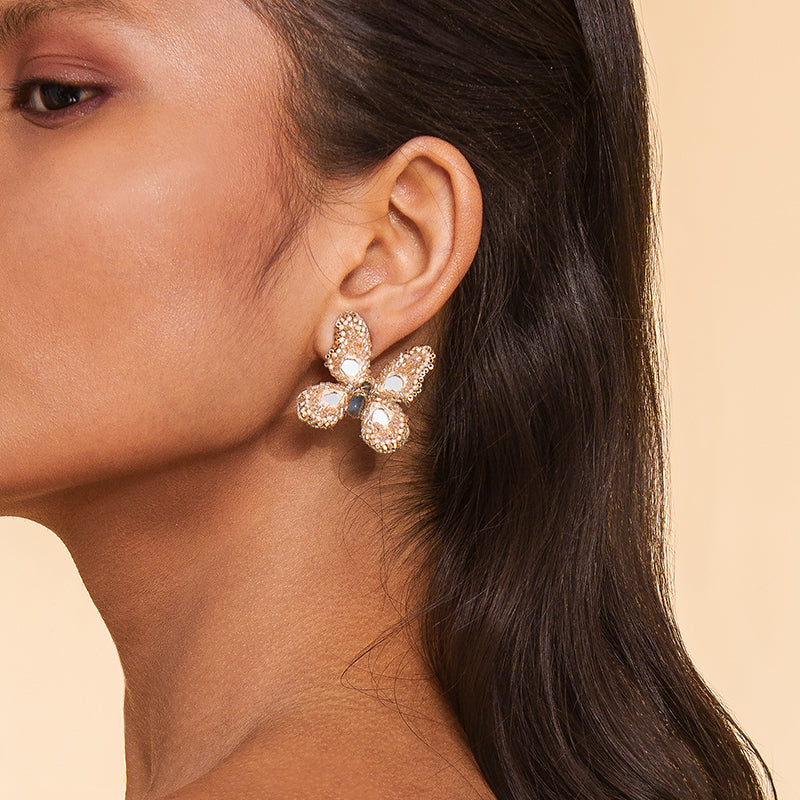 Detail of Model wearing Deepa Gurnani Handmade Echo Earrings in Beige color