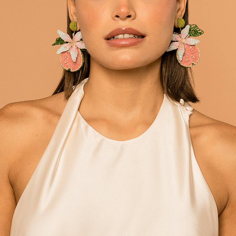 Model Wearing Deepa Gurnani handmade Guava Earrings in Pink color