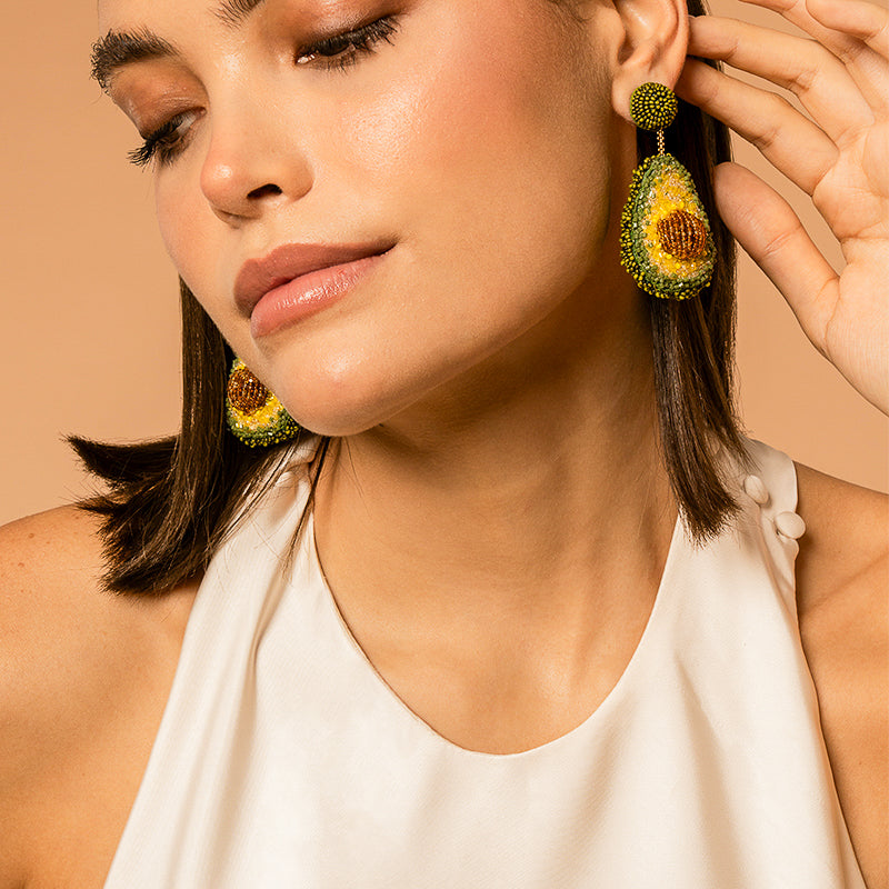 Model Wearing Deepa Gurnani handmade Avocado Earrings in Green color