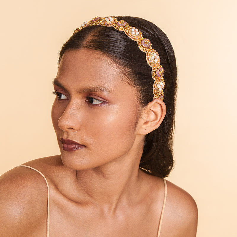 Model wearing Deepa Gurnani handmade the Gwyneth headband in Pink color