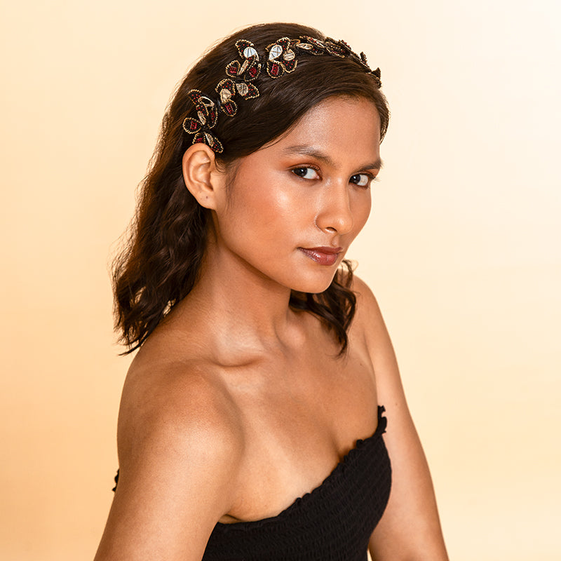 Model wearing Deepa Gurnani handmade the Leia headband in Maroon color