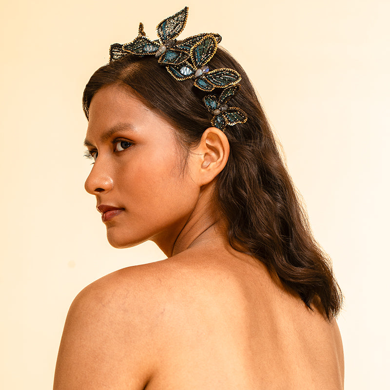 Model wearing Deepa Gurnani handmade Larissa headband in Teal color