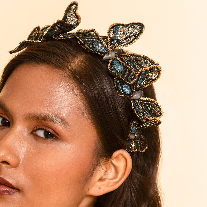 Detail of Model wearing Deepa Gurnani handmade Larissa headband in Teal color