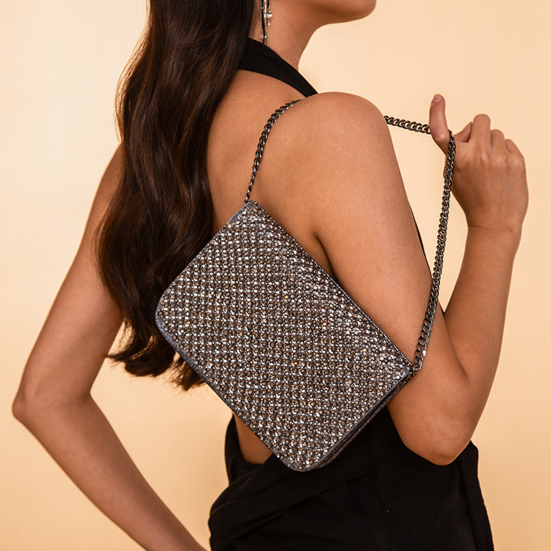 Model Carrying Deepa Gurnani Handmade Aime Clutch In Gunmetal Color