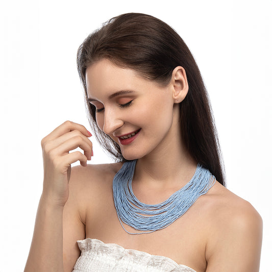 Model wearing Deepa by Deepa Gurnani Handmade Neelam necklace in powder blue color