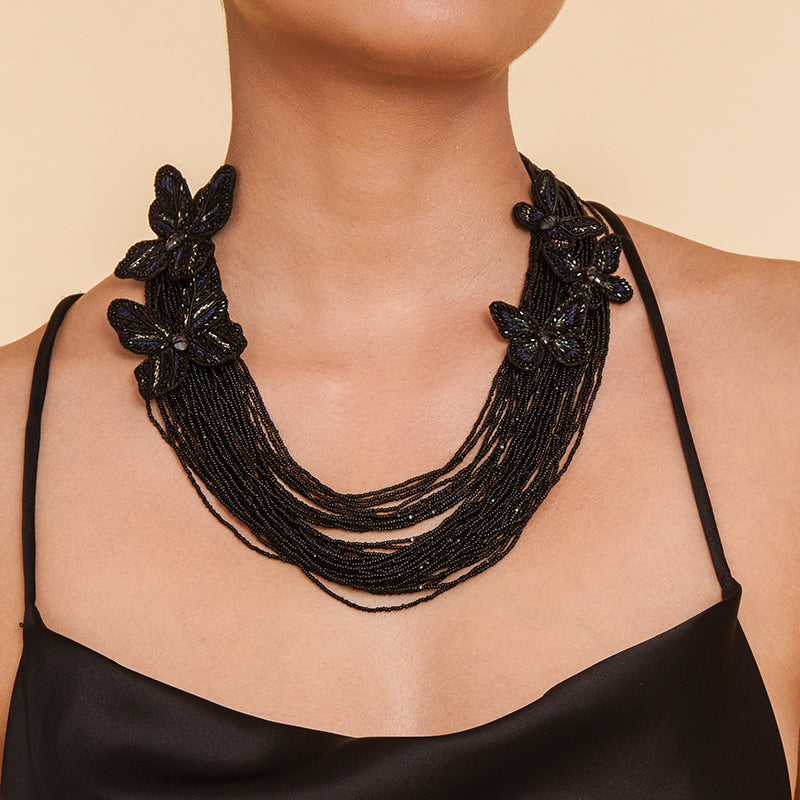 Detail of Model wearing Deepa Gurnani Handmade Black Atlas Necklace