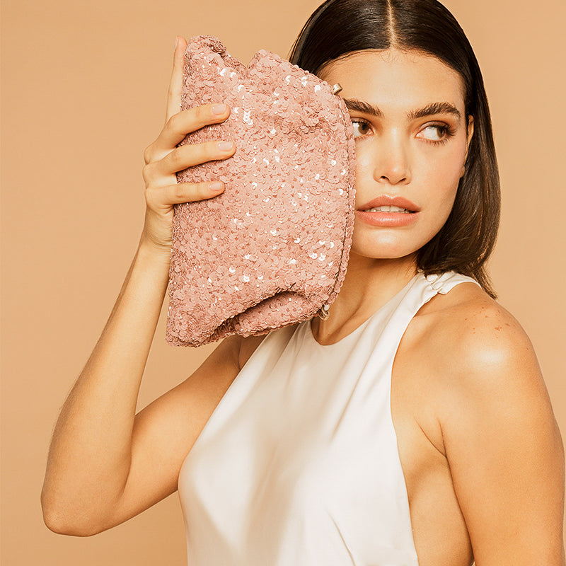 Model Carrying Deepa Gurnani Handmade Hermia Clutch in Dusty Pink color