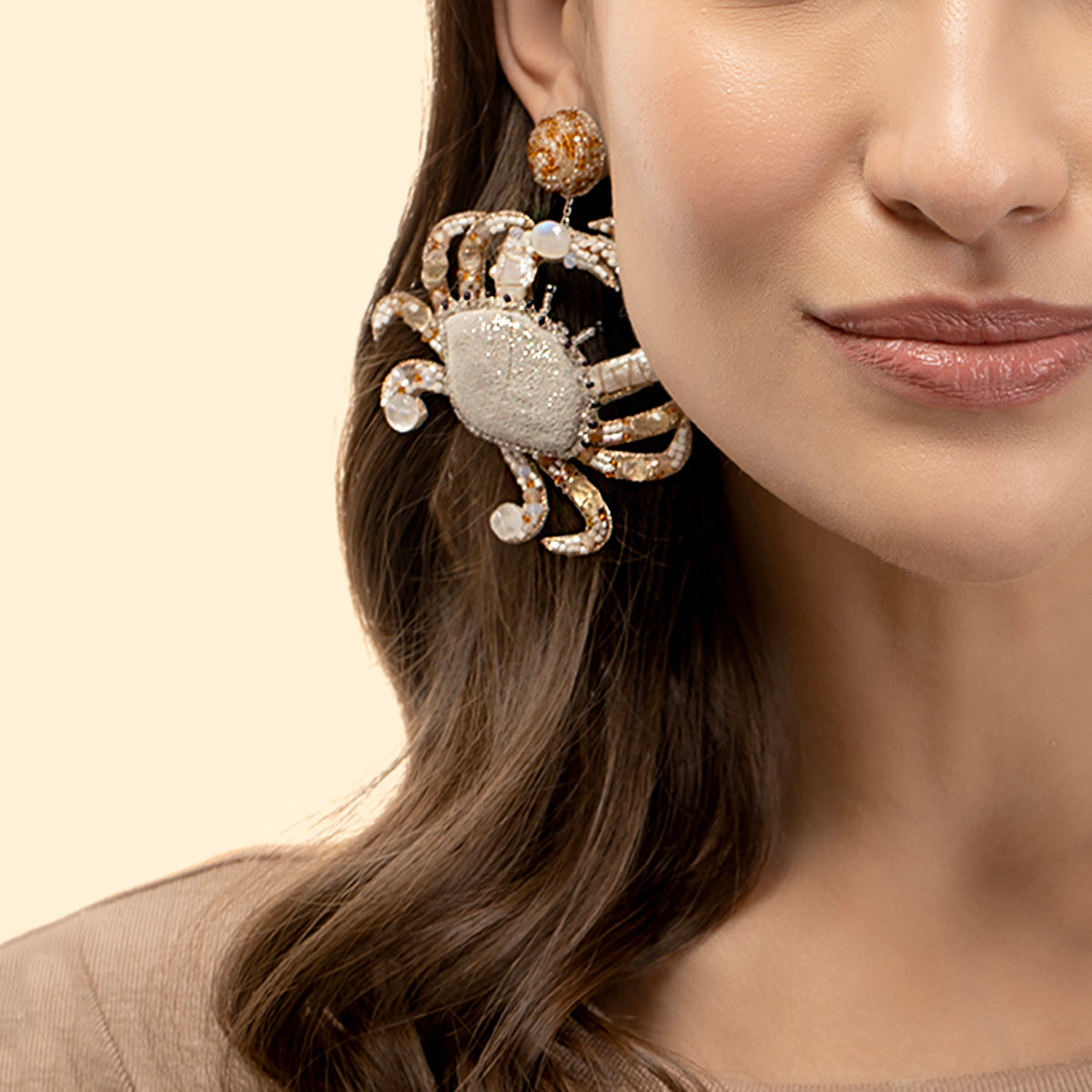 Our Model wearing Deepa Gurnani Handmade Ivory Crab Earrings