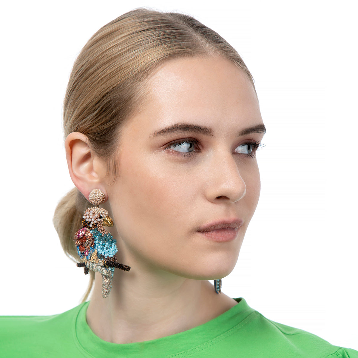 Model Wearing Deepa Gurnani Handcrafted Macaw Tropical Earrings In Multi Color