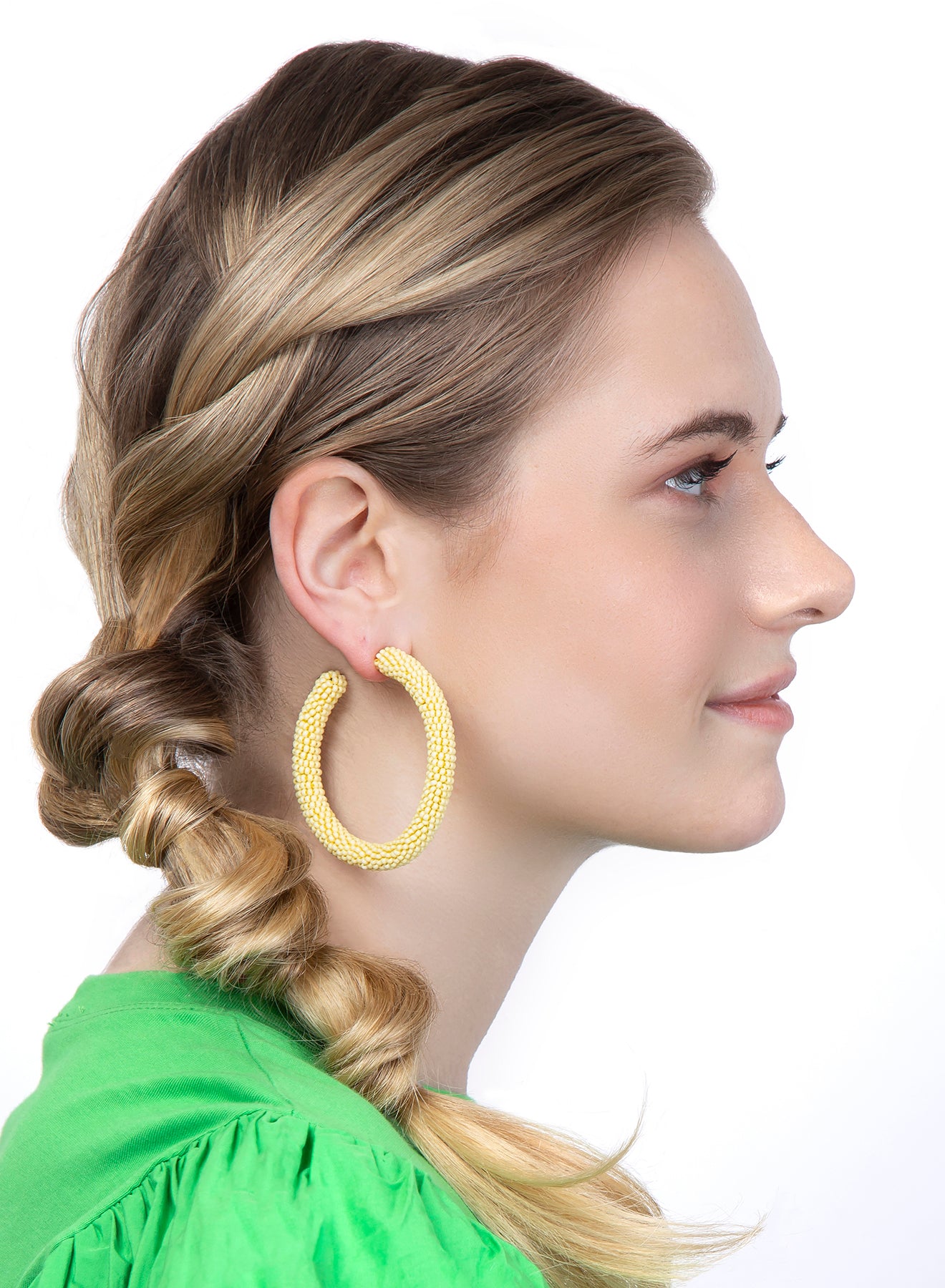 Model wearing our lightweight hoop Light Yellow Zaria Earrings